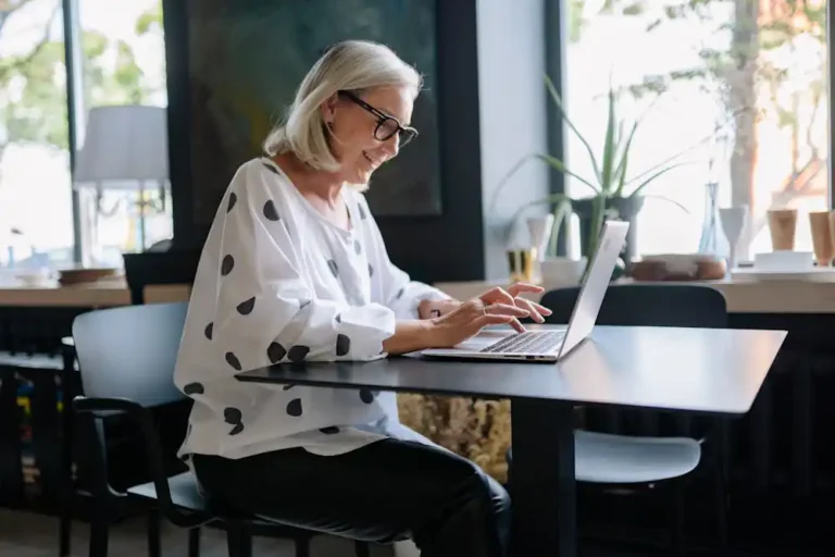 A middle aged woman sitting at a table