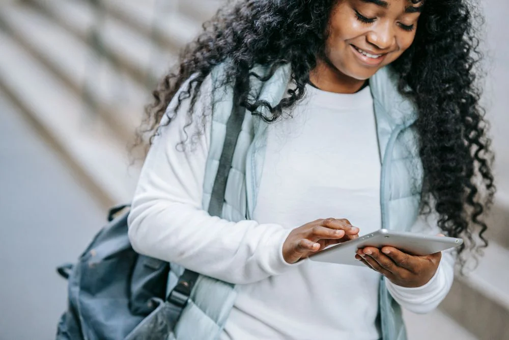 A woman searching digital products to sell online in your 50s