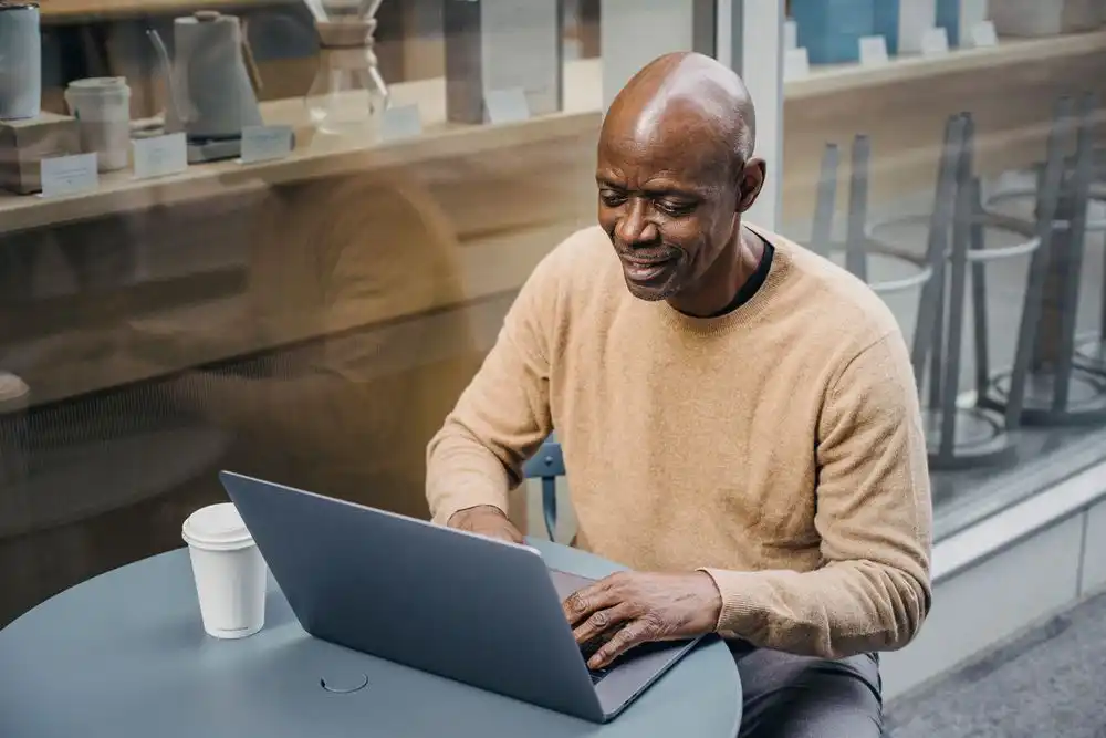 A man doing remote jobs for people over 50